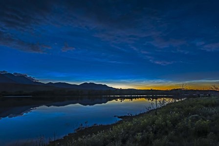 Noctilucent Clouds Glowing and Reflected in Calm Waters of the Waterton River by Alan Dyer/Stocktrek Images art print