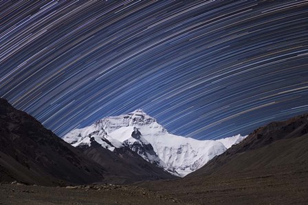 Star Trails Above the Highest Peak and Sheer North Face of the Himalayan Mountains by Jeff Dai/Stocktrek Images art print