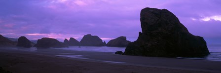 Silhouette of rock formations in the sea against a pink sky, Myers Creek Beach, Oregon by Panoramic Images art print