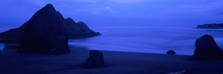 Silhouette of rock formations in the sea at dusk, Myers Creek Beach, Oregon by Panoramic Images art print