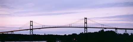 Silhouette of a suspension bridge across a river, Thousand Islands Bridge, St. Lawrence River, New York State, USA by Panoramic Images art print