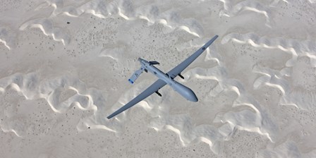 An MQ-1 Predator Flies over the White Sands National Monument, New Mexico by HIGH-G Productions/Stocktrek Images art print