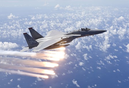 An F-15 Eagle Releases Flares over the Pacific Ocean by HIGH-G Productions/Stocktrek Images art print
