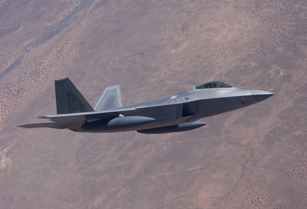 An F-22 Raptor on a Training Mission by HIGH-G Productions/Stocktrek Images art print