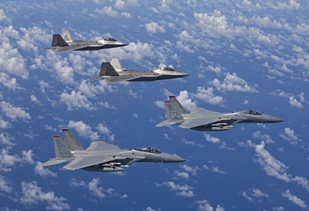 F-15 Eagles and F-22 Raptors Fly in Formation by HIGH-G Productions/Stocktrek Images art print