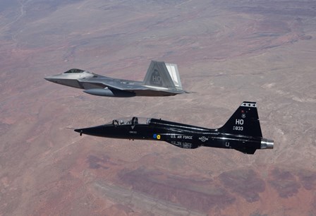 F-22 Raptor and T-38 Talon Fly in Formation over New Mexico by HIGH-G Productions/Stocktrek Images art print