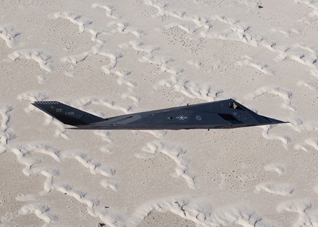 F-117 Nighthawk Flies over White Sands National Monument, New Mexico by HIGH-G Productions/Stocktrek Images art print