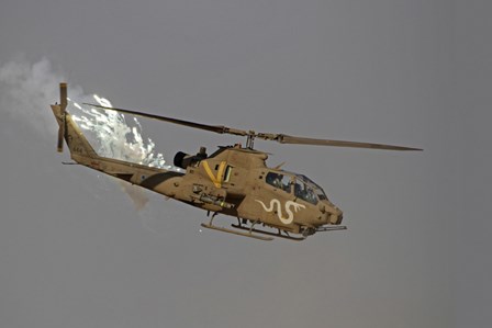 An AH-1S Tzefa of the Israeli Air Force dispenses flares by Ofer Zidon/Stocktrek Images art print