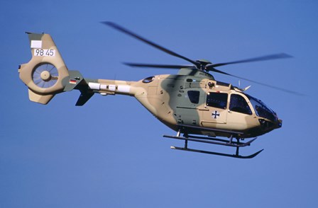 A Eurocopter EC-635 helicopter by Timm Ziegenthaler/Stocktrek Images art print