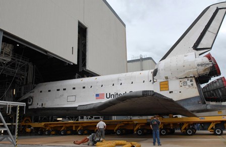 Space Shuttle Atlantis Rolls out of Orbiter Processing Facility 1 at Kennedy Space Center by Stocktrek Images art print
