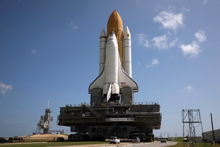 Space Shuttle Discovery makes its way to the launch pad at Kennedy Space Center by Stocktrek Images art print