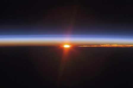 Layers of Earth&#39;s atmosphere, brightly colored as the sun sets over South America by Stocktrek Images art print
