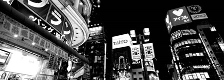 Low angle view of buildings lit up at night, Tokyo, Japan by Panoramic Images art print