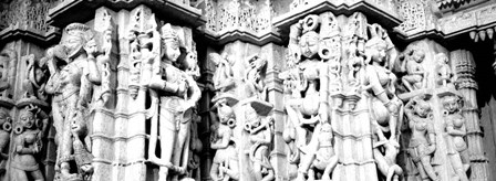 Sculptures carved on a wall of a temple, Jain Temple, Ranakpur, Rajasthan, India BW by Panoramic Images art print