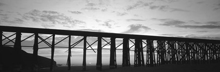 Silhouette of a railway bridge, Fort Bragg, California by Panoramic Images art print