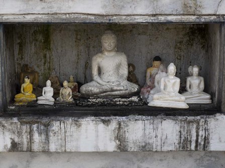 Niche at Ruwanwelisaya Dagoba filled with Buddha statues as offerings, Anuradhapura, Sri Lanka by Panoramic Images art print